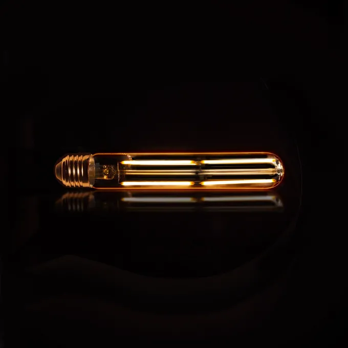 WoonStijl Lichtbron LED filament buis 18 5 cm - E27 4W 2100K 280lm dimbaar / Amberkleurig glas